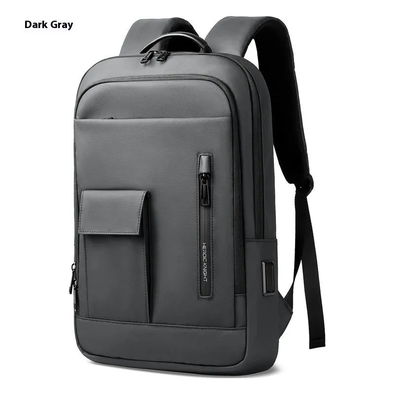 Men's lightweight Oxford cloth backpack in dark grey, shown from the side with visible sewing line details.
