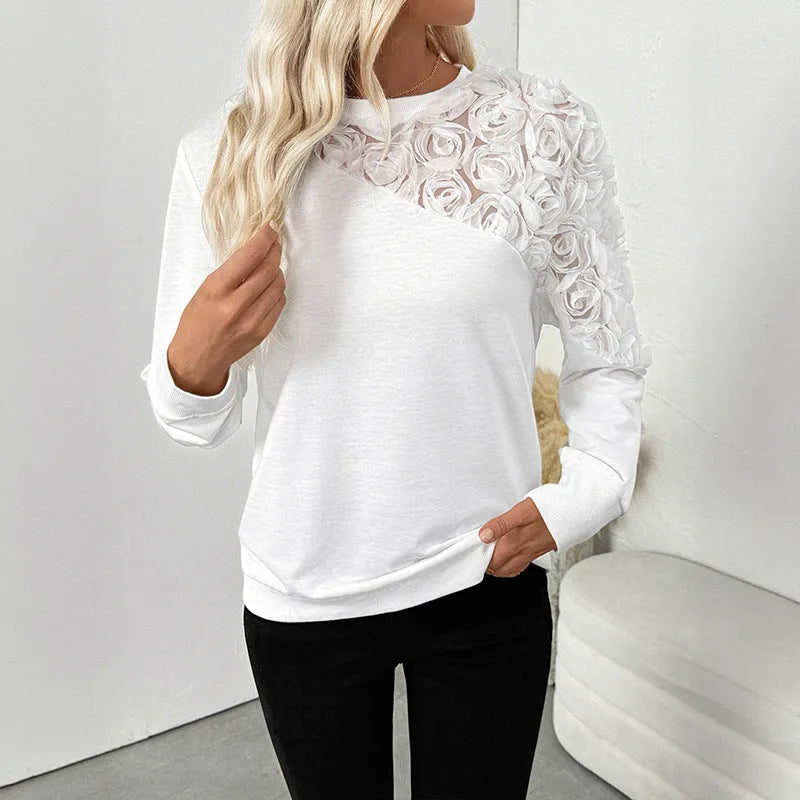 White women's long sleeve pullover top with floral pattern, loose fitting