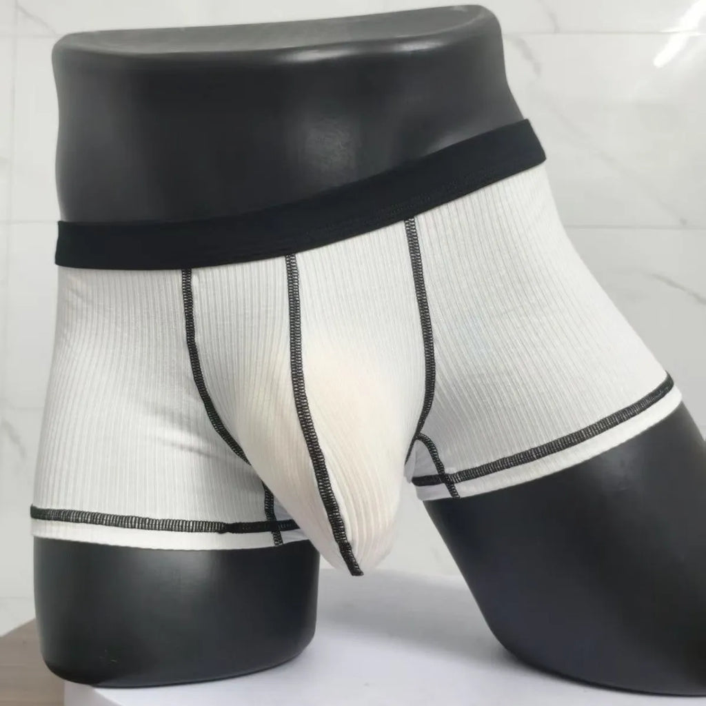 Men's solid colour boxers showing hip lifting and body shaping design in breathable fibre fabric