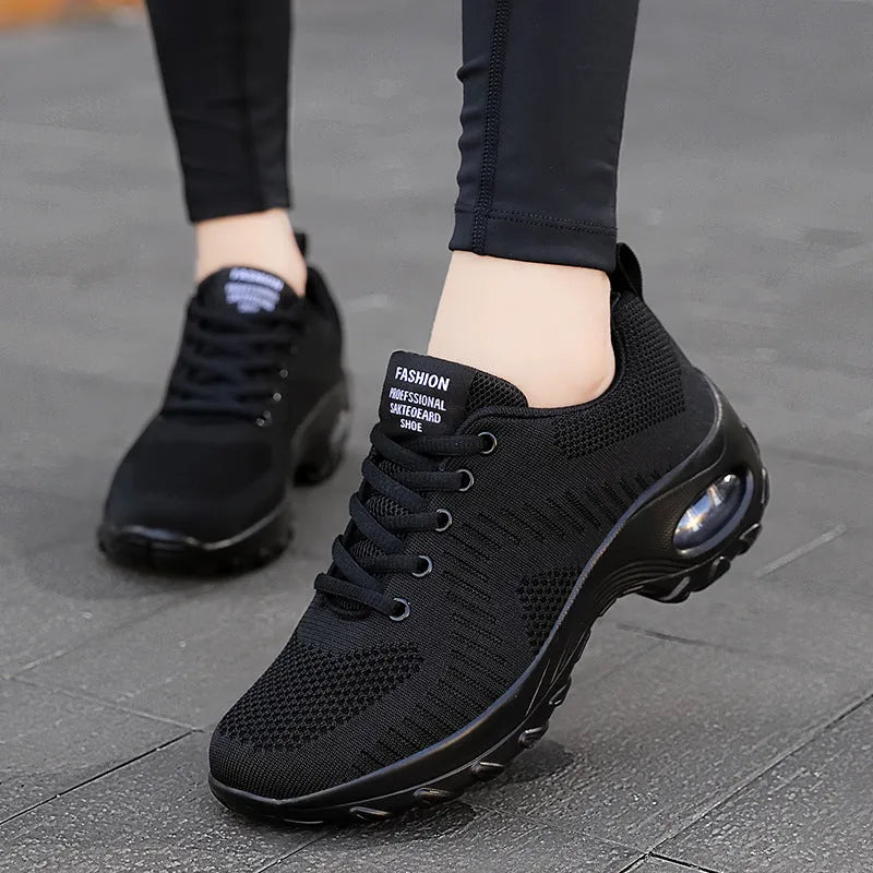 Red women's mesh sneakers with front lace-up and round toe design for casual sports
