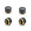 Four black Bluetooth tyre pressure monitors for mobile phone app display.