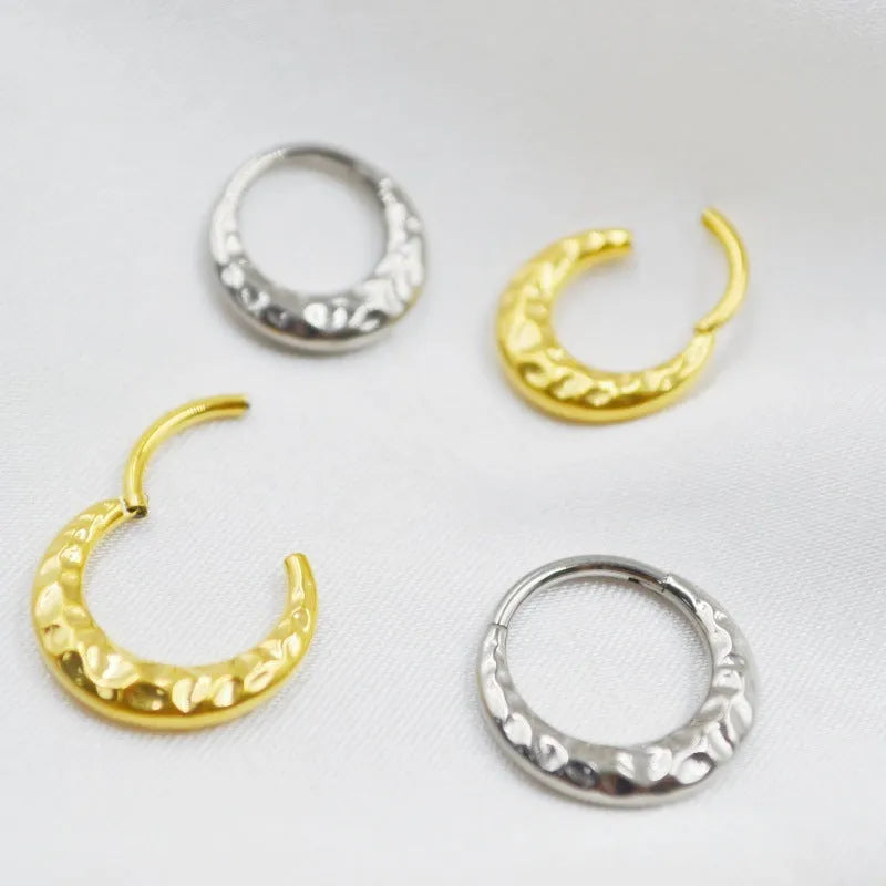 Titanium alloy concave-convex nose ring with carving detail in gold or silver colour.