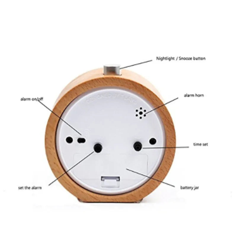 Solid beech wood silent snooze alarm clock showing wooden case, glass mirror face, and 9.5cm diameter