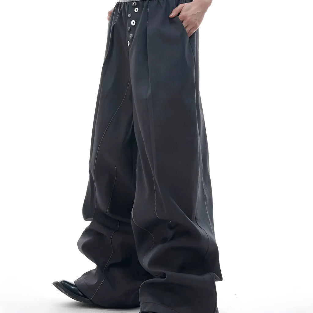 Drooping straight-leg trousers with button-open line design in black and grey colours