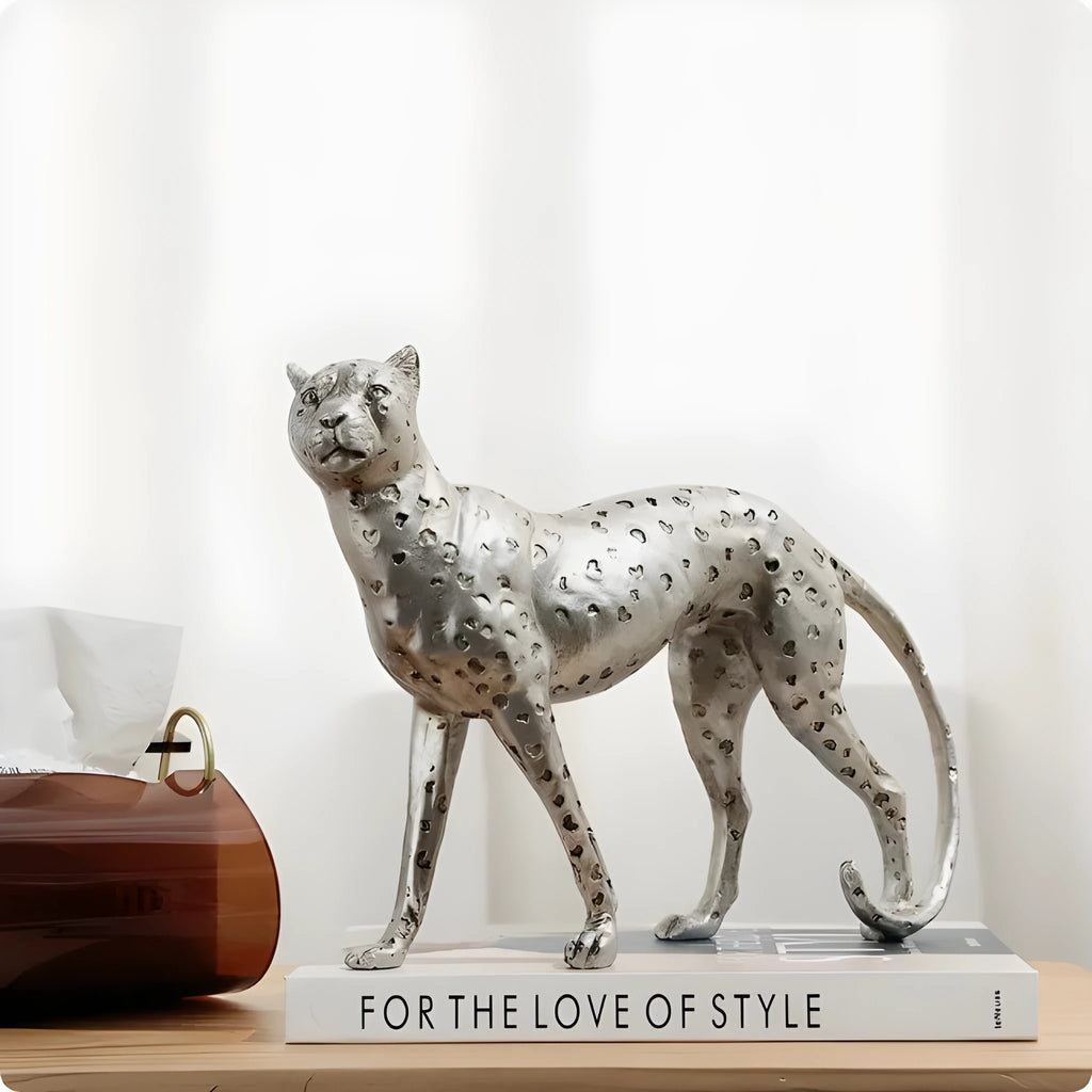 Leopard-shaped resin home ornament in American Leopard colour on wooden surface
