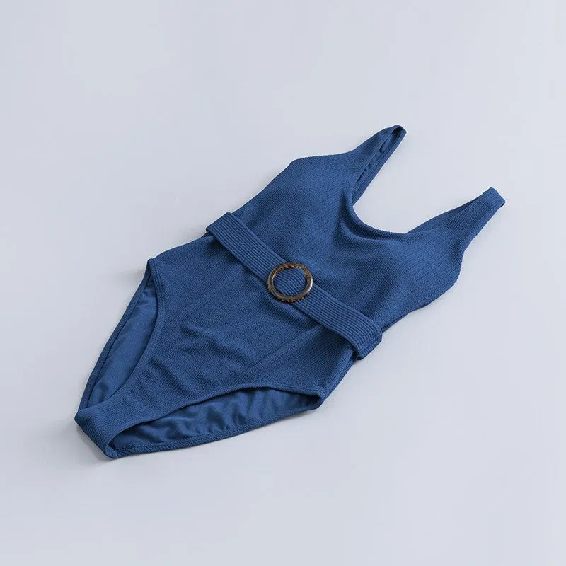 Navy blue women's one-piece slimming swimsuit with triangle design and chest pad.