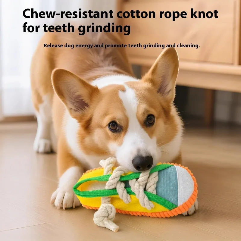 Slipper-shaped plastic dog chew toy with squeaker in three colour options