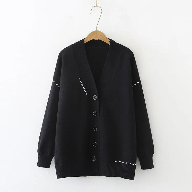 Women's polyester knitted cardigan coat in black or white with long sleeves