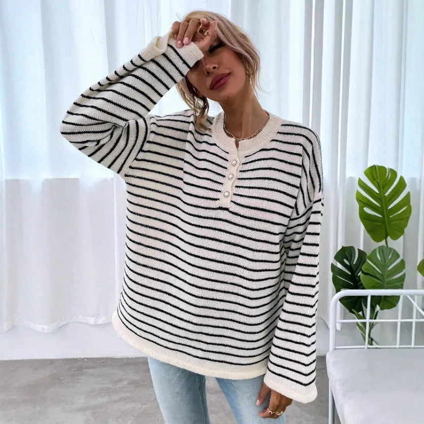 Black striped women's casual top with drop shoulders and button detail