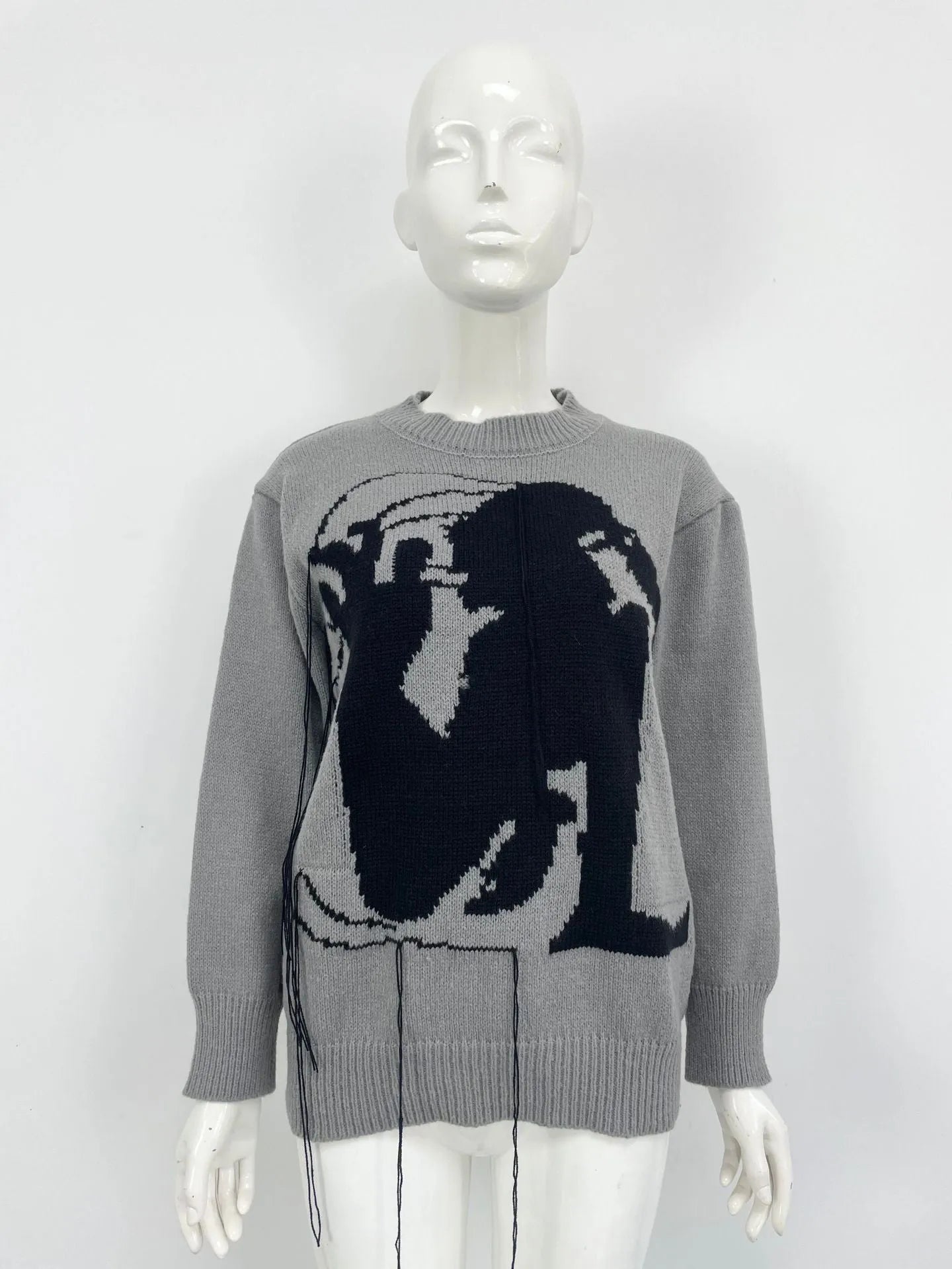 Women's grey alpaca wool sweater with tassel detailing and abstract pattern