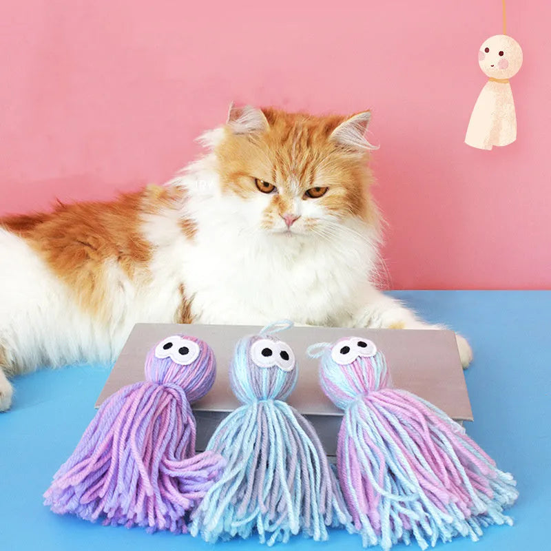 Set of four hanging wool ball cat toys with plastic teaser sticks in blue grey, pink and blue, and pink purple colours