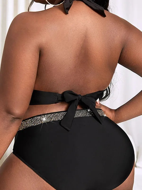 Black plus size women's bikini swimsuit showing bra and shorts two-piece design