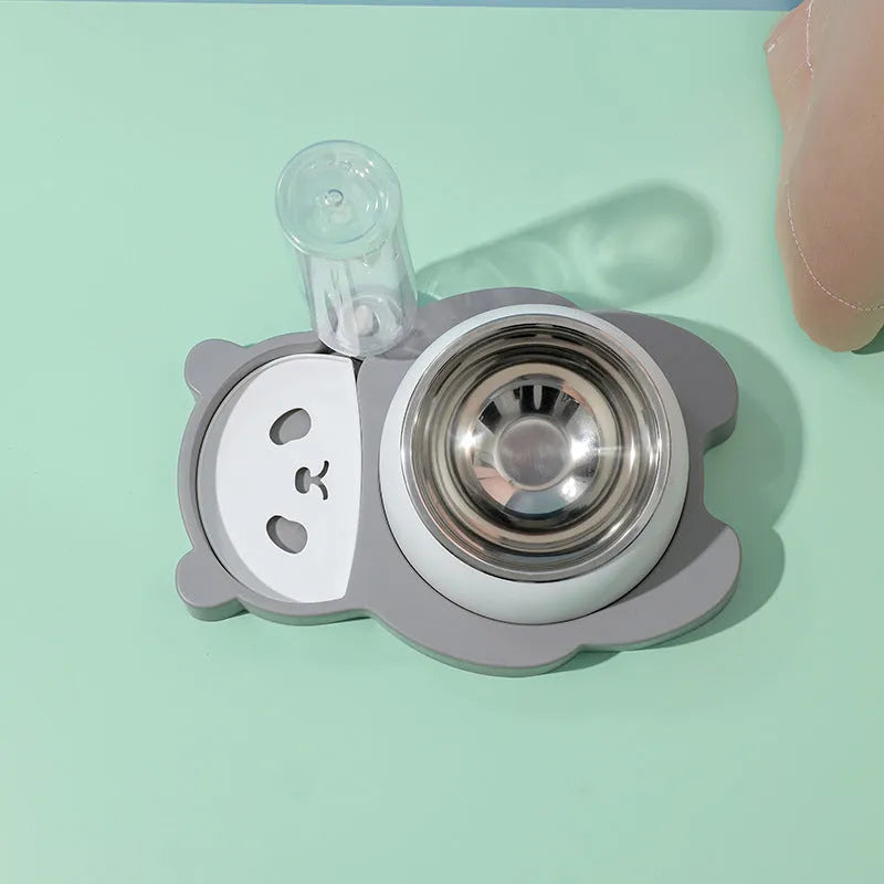 Grey panda-shaped automatic pet water dispenser with tilted stainless steel feeding bowls for cats and small dogs.