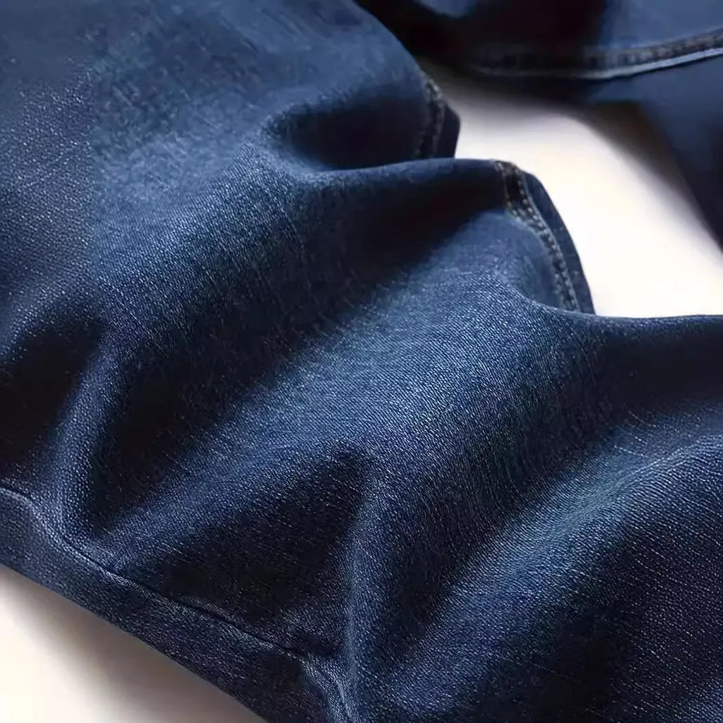 Men's slim-fit dark blue cotton jeans with mid waist and zipper fly