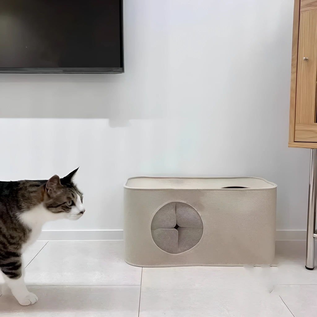 A grey foldable felt cat nest bed shown open and flat for storage.