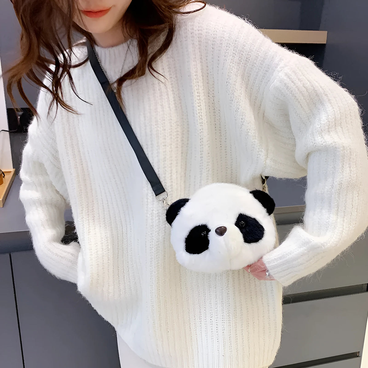 Plush panda head design crossbody bag showing cylindrical shape and sandwich pocket