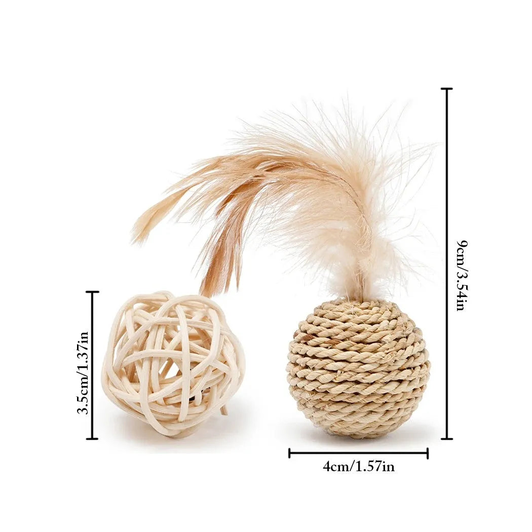 Two cat toys: a rattan ball with a bell and a faux feather ball on a plain background.
