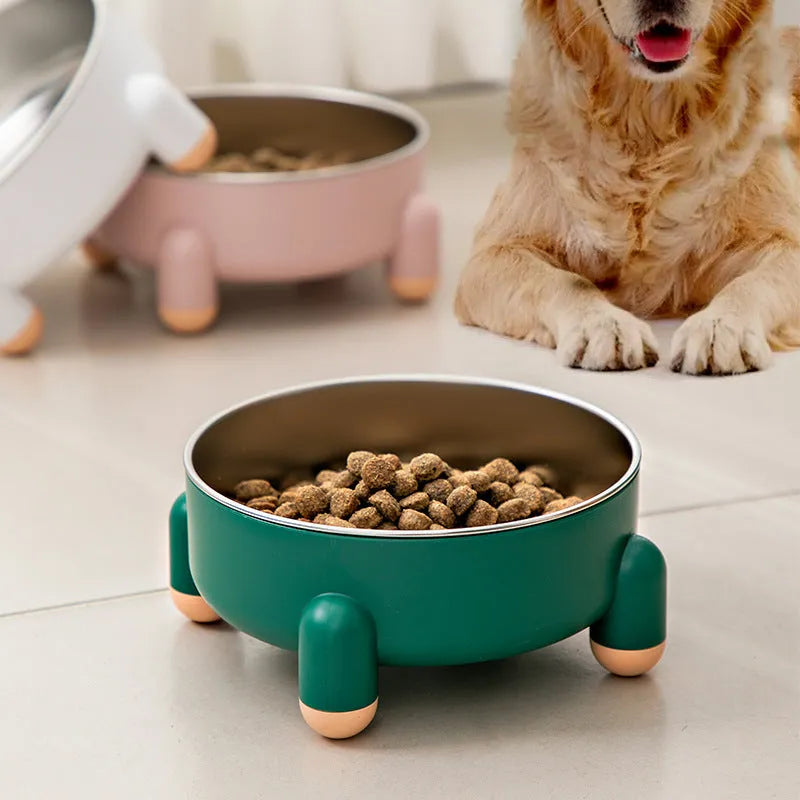 Green non-slip stainless steel pet food bowl with a high foot, shown on a floor.