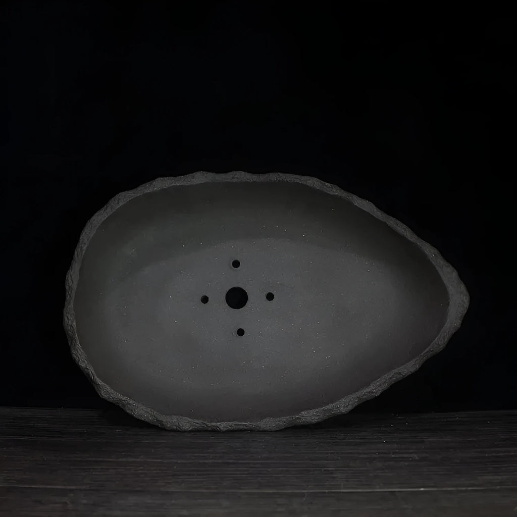 Handmade purple clay flower pot showing traditional craftsmanship and floor-standing design