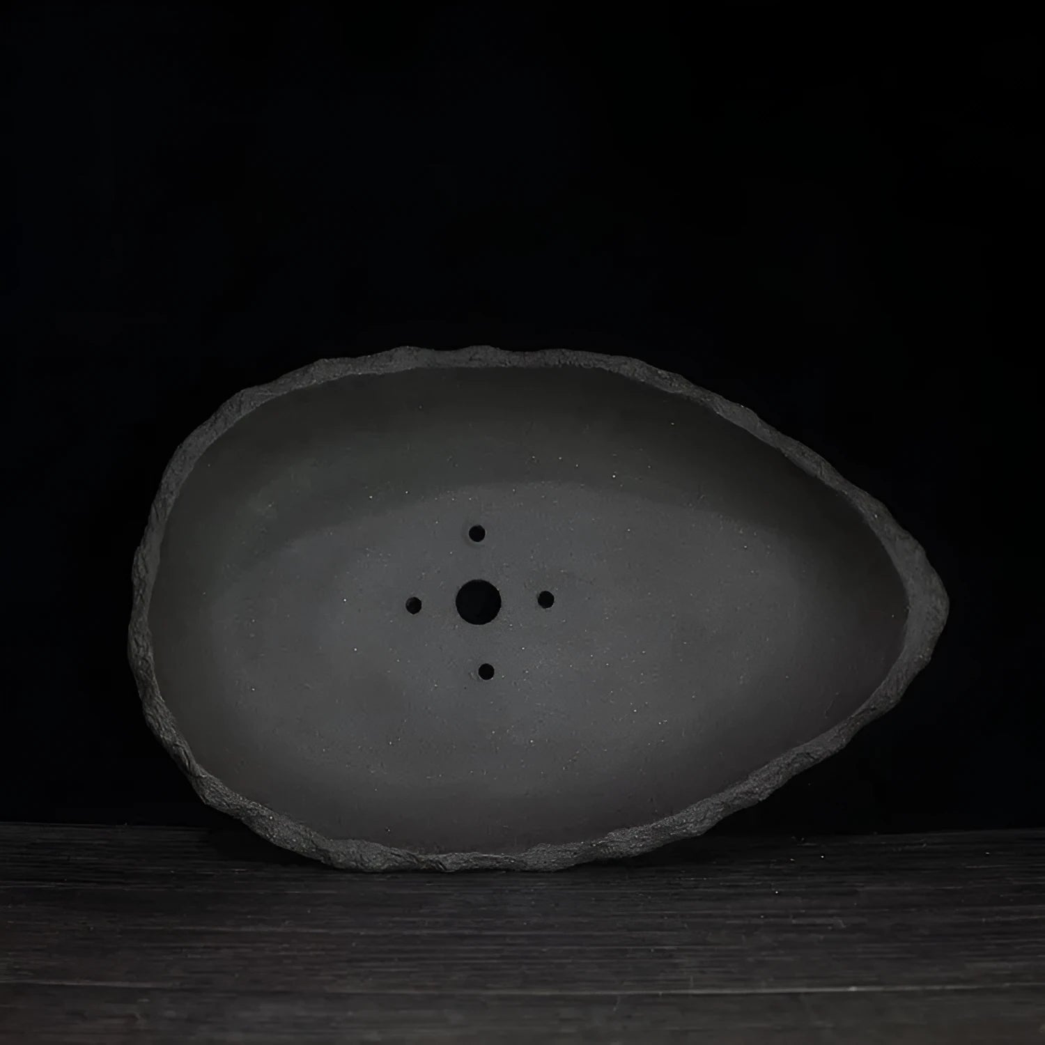 Handmade purple clay flower pot showing traditional craftsmanship and floor-standing design