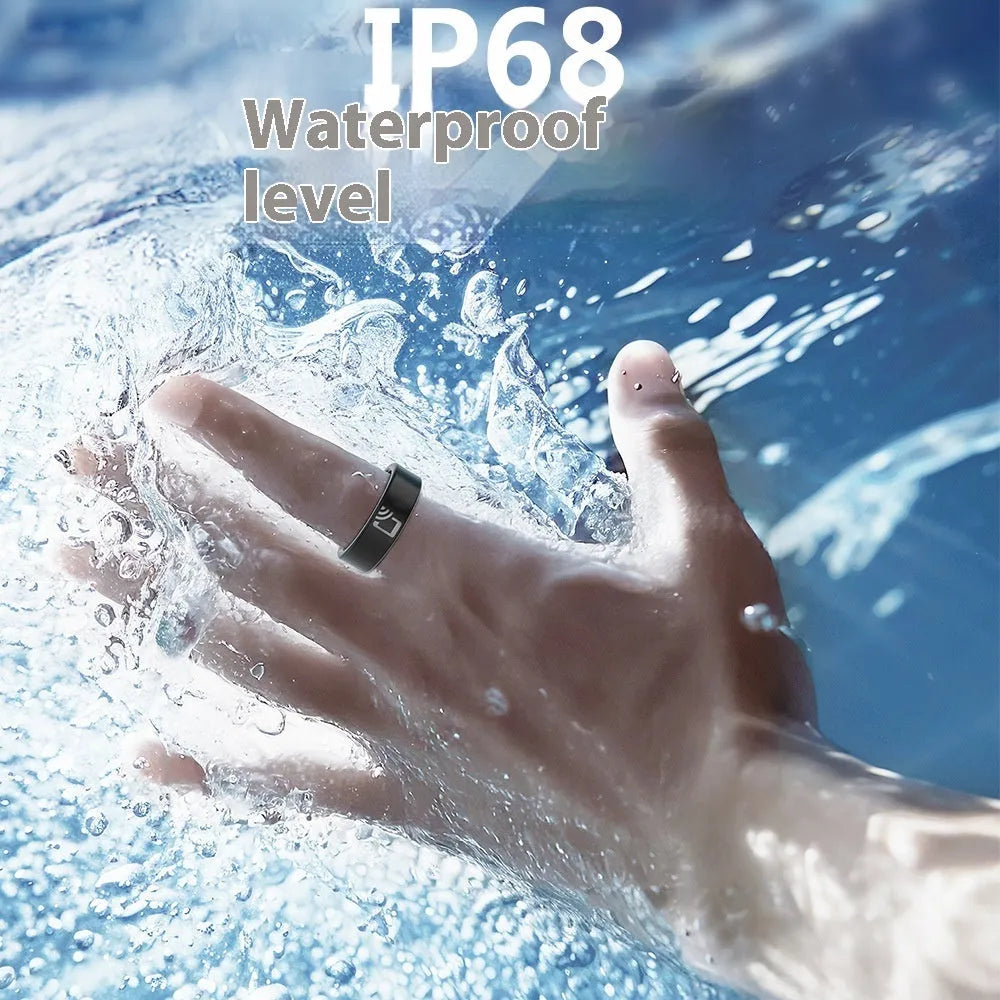 Black ceramic smart ring for health monitoring, shown with a charging case on a grey background.