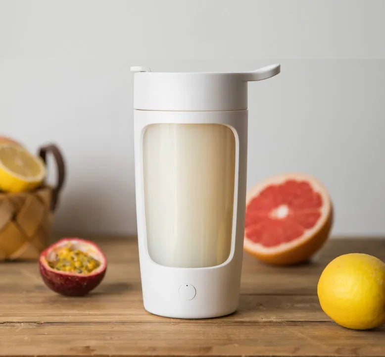 Portable automatic blending cup in chosen colour, showing measuring lid and compact size.