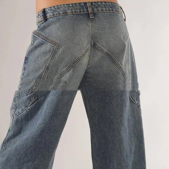 Women's loose blue cotton wide-leg mop trousers with low waist and spliced panelling on a mannequin.