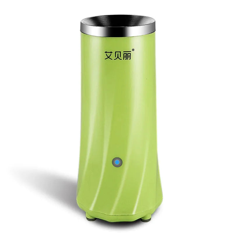 Compact beige and green automatic breakfast machine on kitchen countertop