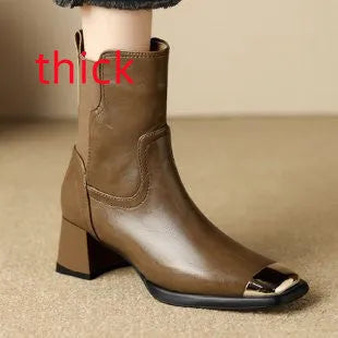 Brown cowhide leather women's Martin boots with side zipper and high heel on a white background.