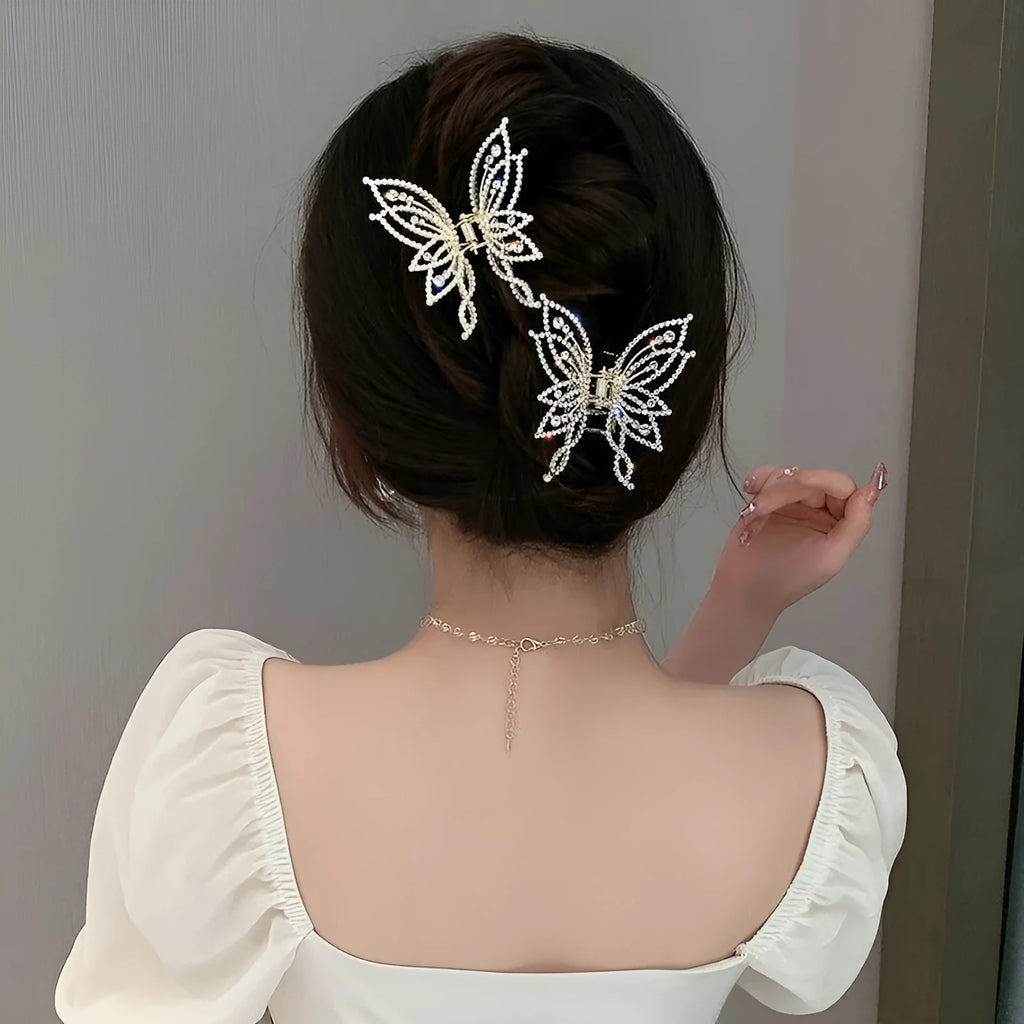 Butterfly-shaped alloy hair clip barrette for women, available in rhinestone and pearl styles.