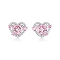 A pair of white heart-shaped stud earrings for women on a plain background.