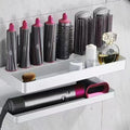 White two-layer aluminium bathroom storage rack holding Marcel wavers without drilling required