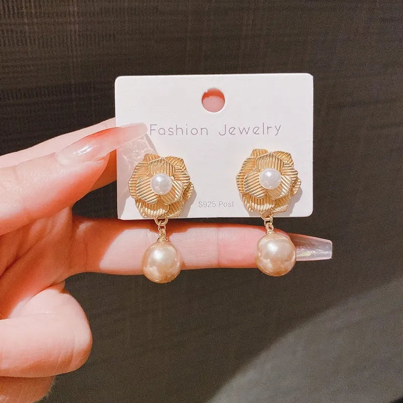 Gold Hong Kong style flower stud earrings with needle rose pearl design and opal stones