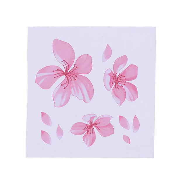 Close-up of a pink and white cherry blossom car sticker on a clear PVC backing.