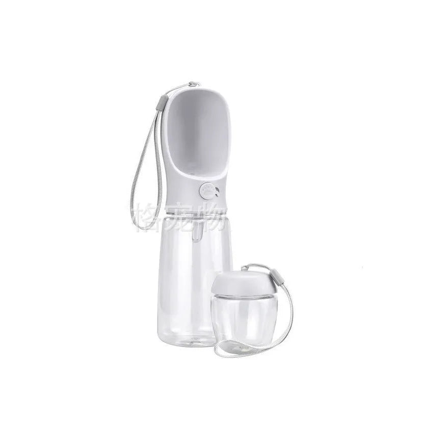 Blue portable plastic dog water bottle with integrated drinking trough for outings.