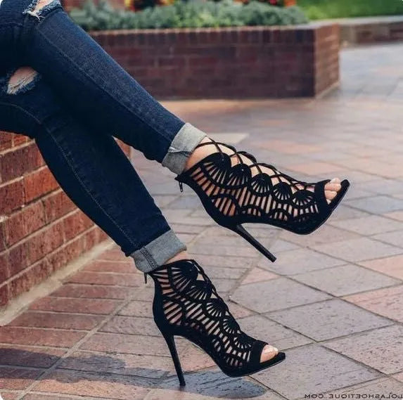 Black suede lace high heels with fish mouth toe, stiletto heel above 8 cm, and hollow detail.