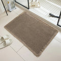 A checkered pattern non-slip polyester bathroom floor carpet shown in a beige colour.