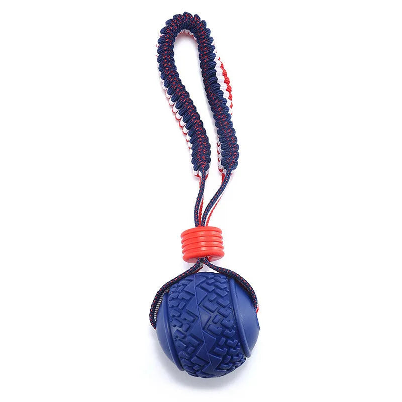 Blue or red natural rubber dog ball with attached rope for tug-of-war and teeth cleaning