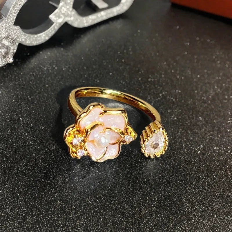 Adjustable copper ring featuring a gourd, flower, and bow design with zircon inlay in New Chinese style.