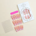 Water transfer nail art stickers with long pipe and bow design next to a plastic armour suit applicator.