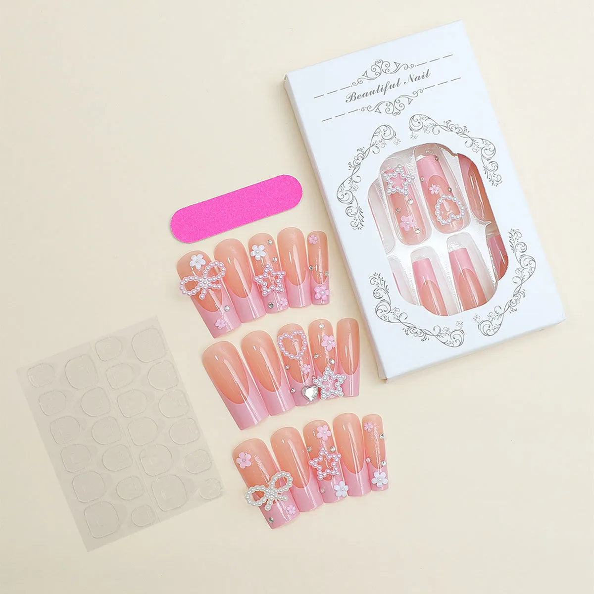 Water transfer nail art stickers with long pipe and bow design next to a plastic armour suit applicator.