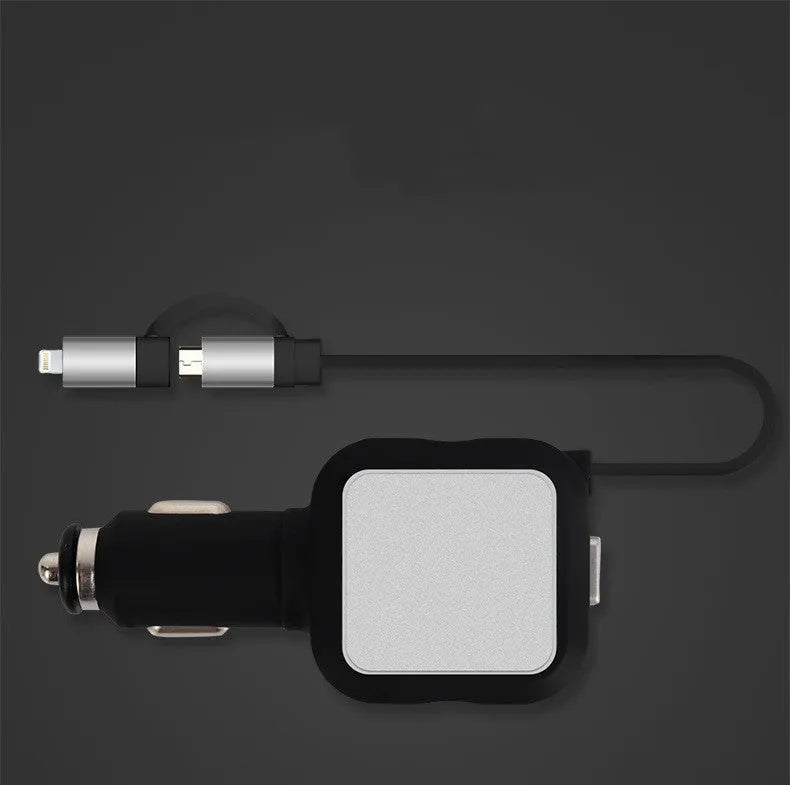 Black and gold dual USB car charger with retractable cable plugged into a car's 12V socket.