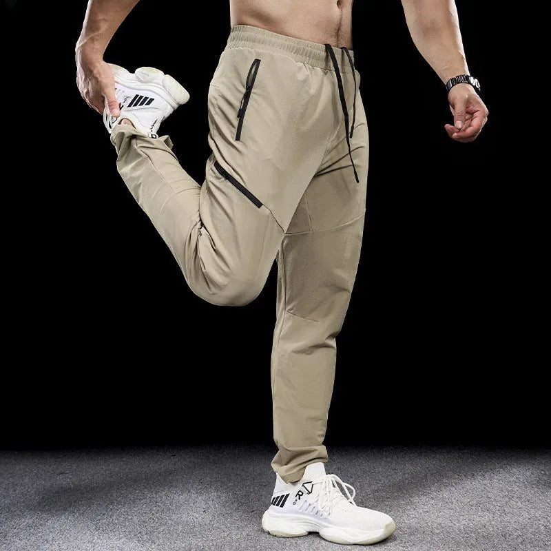 Men's waterproof quick-dry nylon workout trousers in multiple colours on a size chart.