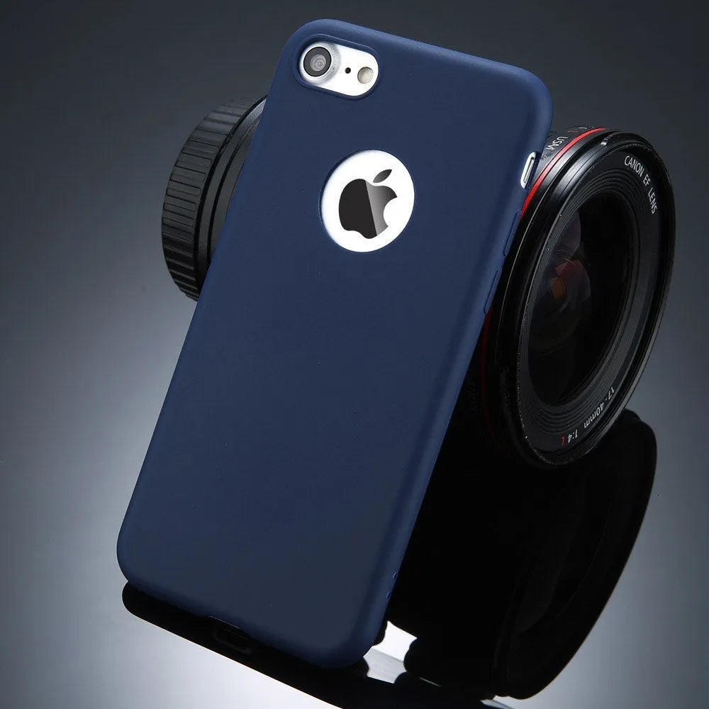 Plain soft silicone TPU phone case for iPhone in a candy colour on a table.