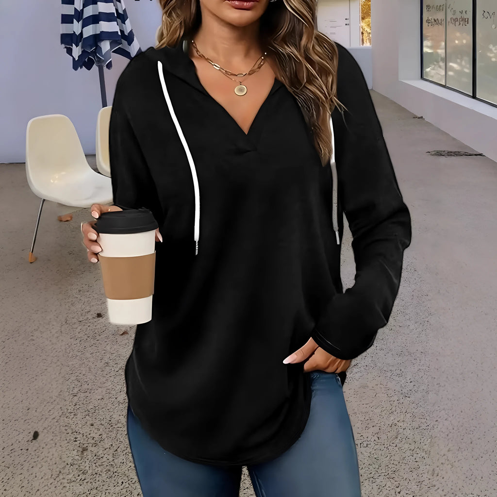 A red women's V-neck sweatshirt with an attached hood, shown in a loose, medium-length fit.