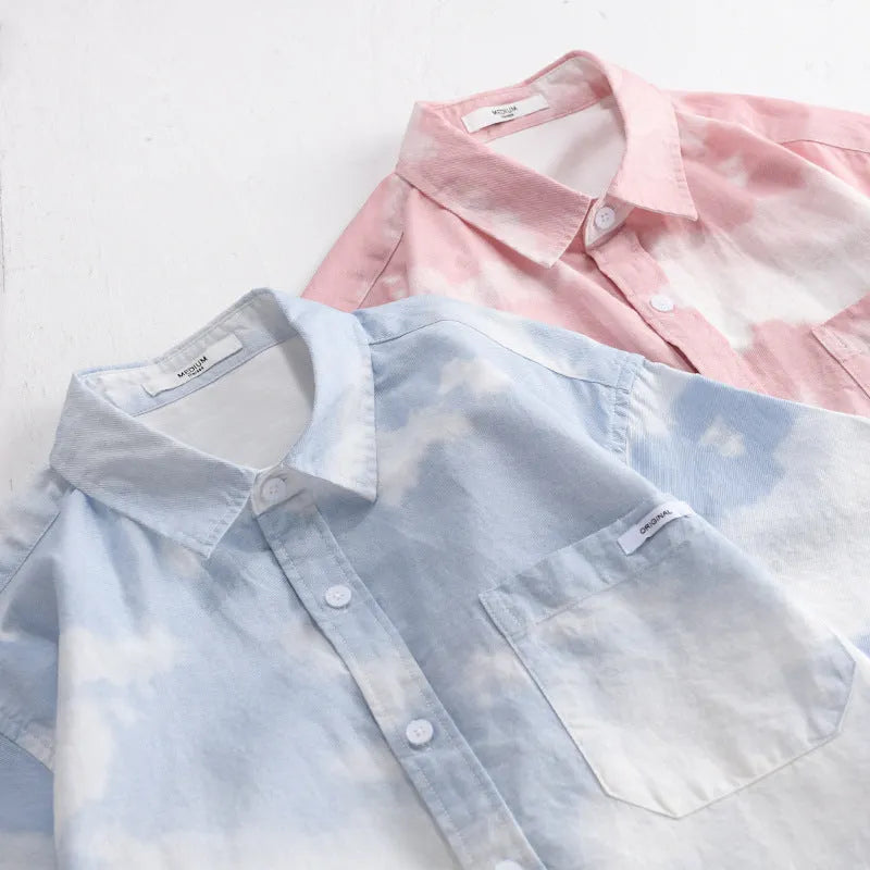 Light pink men's loose-fit cotton cardigan shirt on a hanger