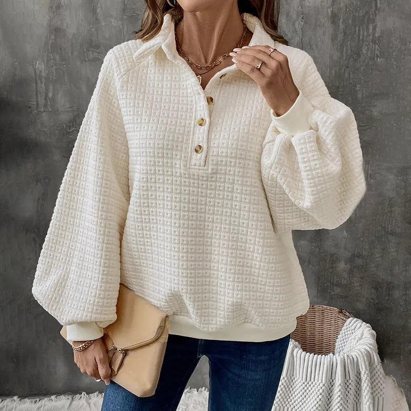 Women's beige polo collar pullover sweater with long sleeves, laid flat.