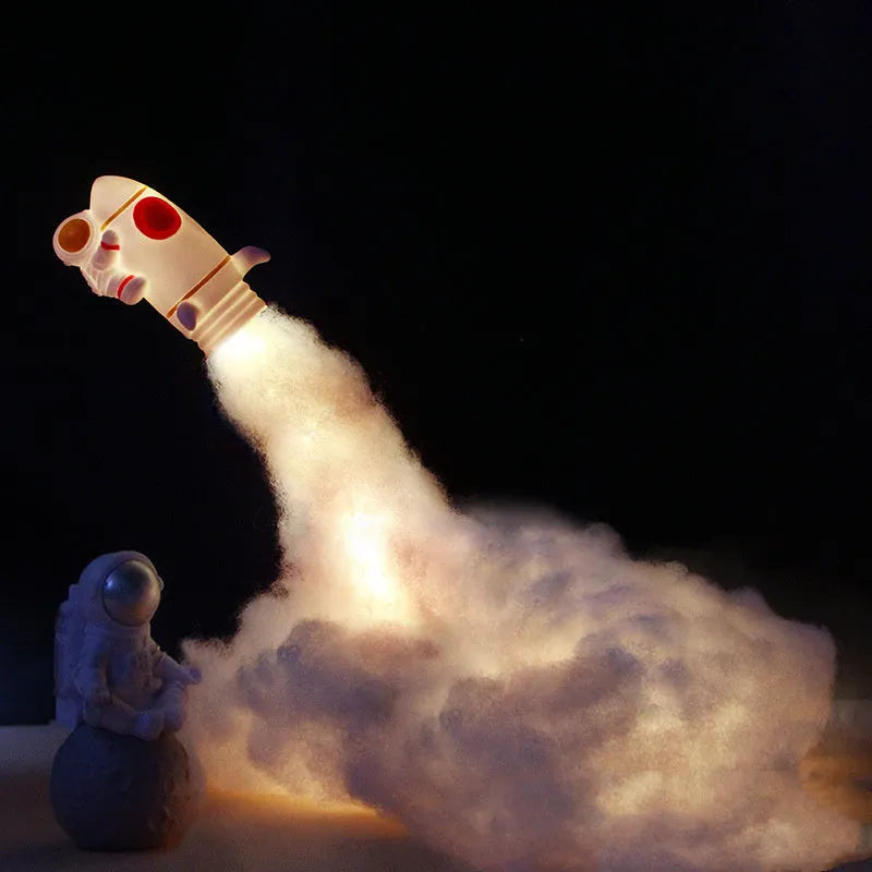 DIY astronaut rocket LED night light kit components including model, string lights, straws, and chassis.