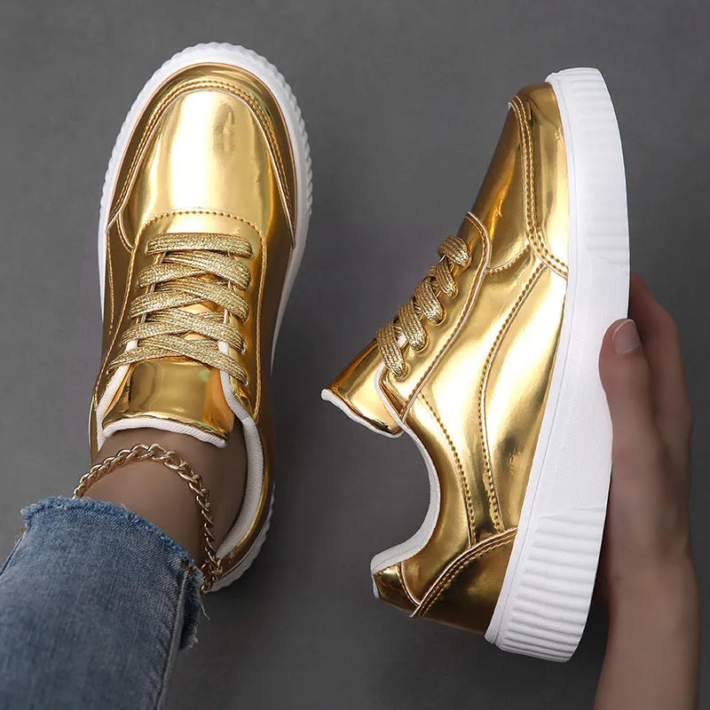 Rose gold sequin platform sneaker with thick sole and round toe on a white background.