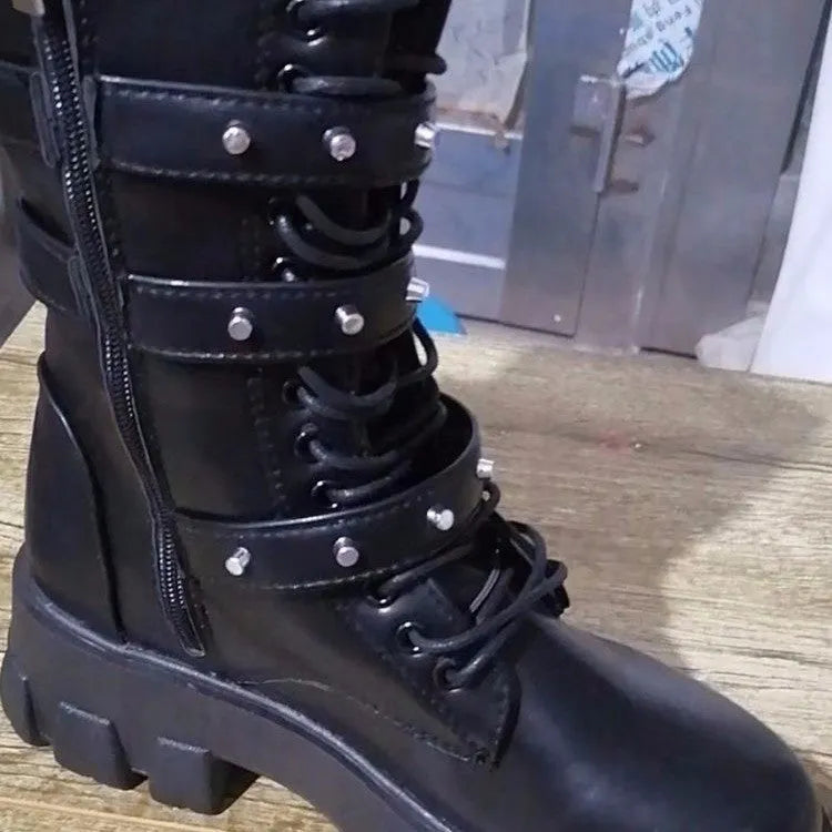 Black women's mid-calf knight boots with metal buckle straps and a side zipper on a round toe.
